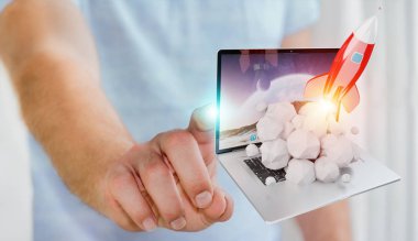Bir laptop 3d render roket başlatılması ile iş adamı