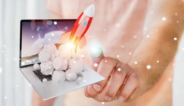 Bir laptop 3d render roket başlatılması ile iş adamı