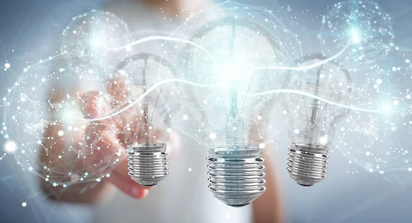 Businessman connecting modern lightbulbs with connections 3D ren — Stock Photo, Image