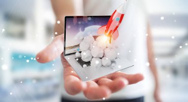 Bir laptop 3d render roket başlatılması ile iş adamı