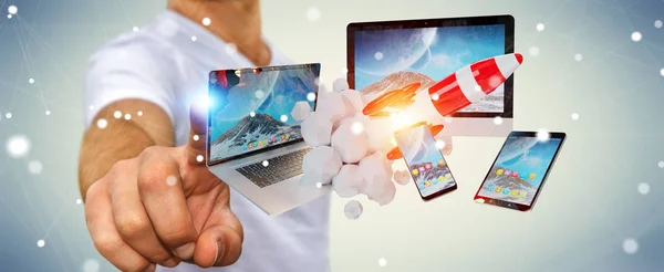 Businessman connecting tech devices and startup rocket 3D render — Stock Photo, Image