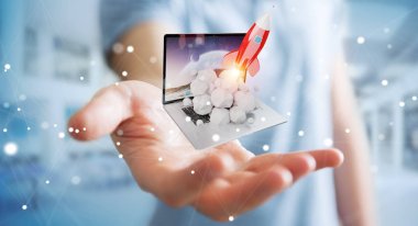 Bir laptop 3d render roket başlatılması ile iş adamı