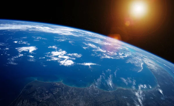 View of planet Earth close up with atmosphere during a sunrise 3