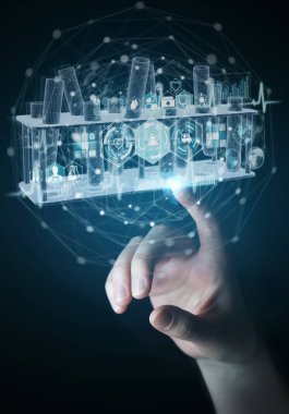 Koyu arkaplan üzerinde insan eli tutarak ve holografik tüplere dokunarak projeksiyon 3 boyutlu görüntüleme