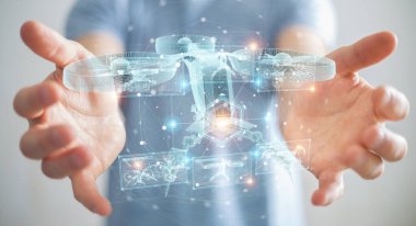 Bulanık arka plan tutuşu ve ellerindeki holografik insansız hava aracı projeksiyonuna dokunan iş adamı