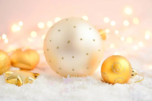 Christmas decorations on snow and Christmas lights. Festive Christmas background — Stock Photo, Image