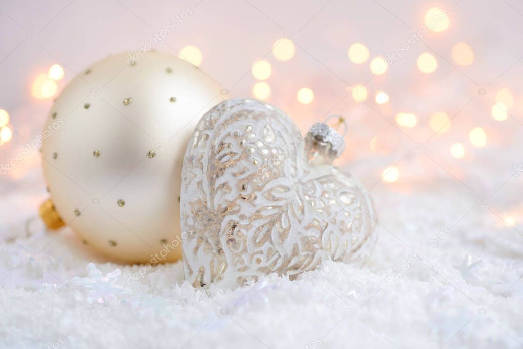 Christmas decorations on snow and Christmas lights. Festive Christmas background