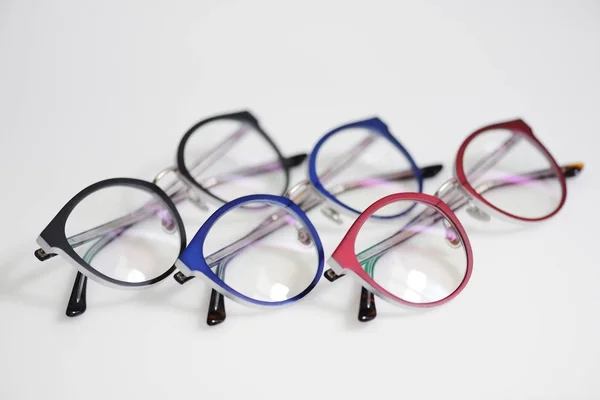 Multicolored glasses on the white background Stock Picture