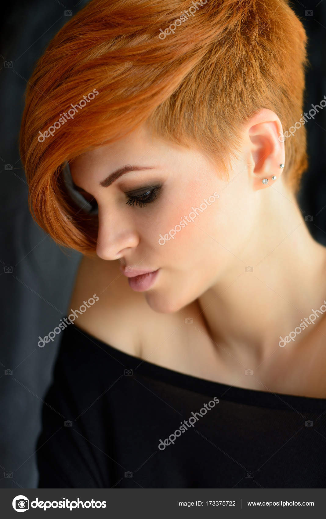 Portrait Of A Beautiful Young Red Haired Woman With Short Hair On