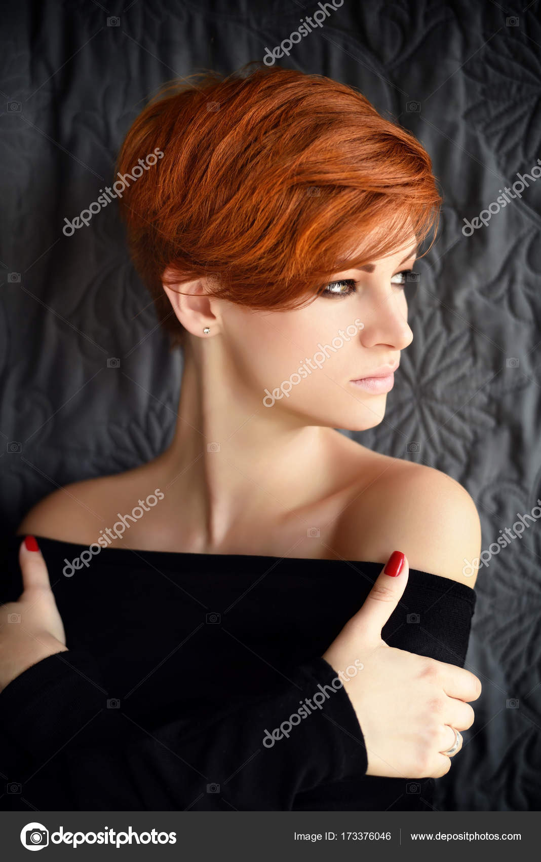 Portrait Of A Beautiful Young Red Haired Woman With Short Hair On