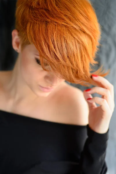 Portrait of a beautiful young red-haired woman with short hair — Stock Photo, Image