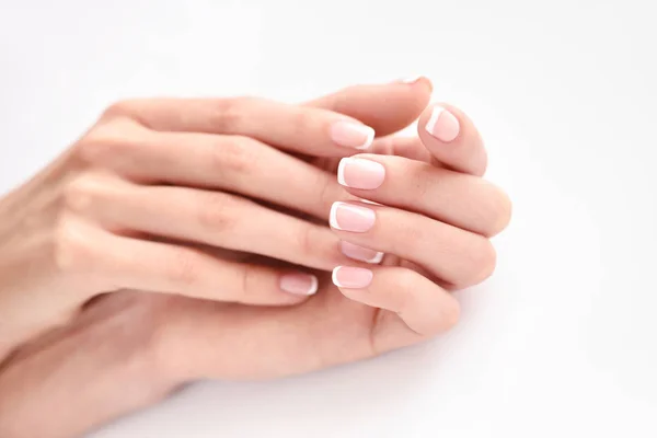 Beautiful woman hands with french manicure — Stock Photo, Image