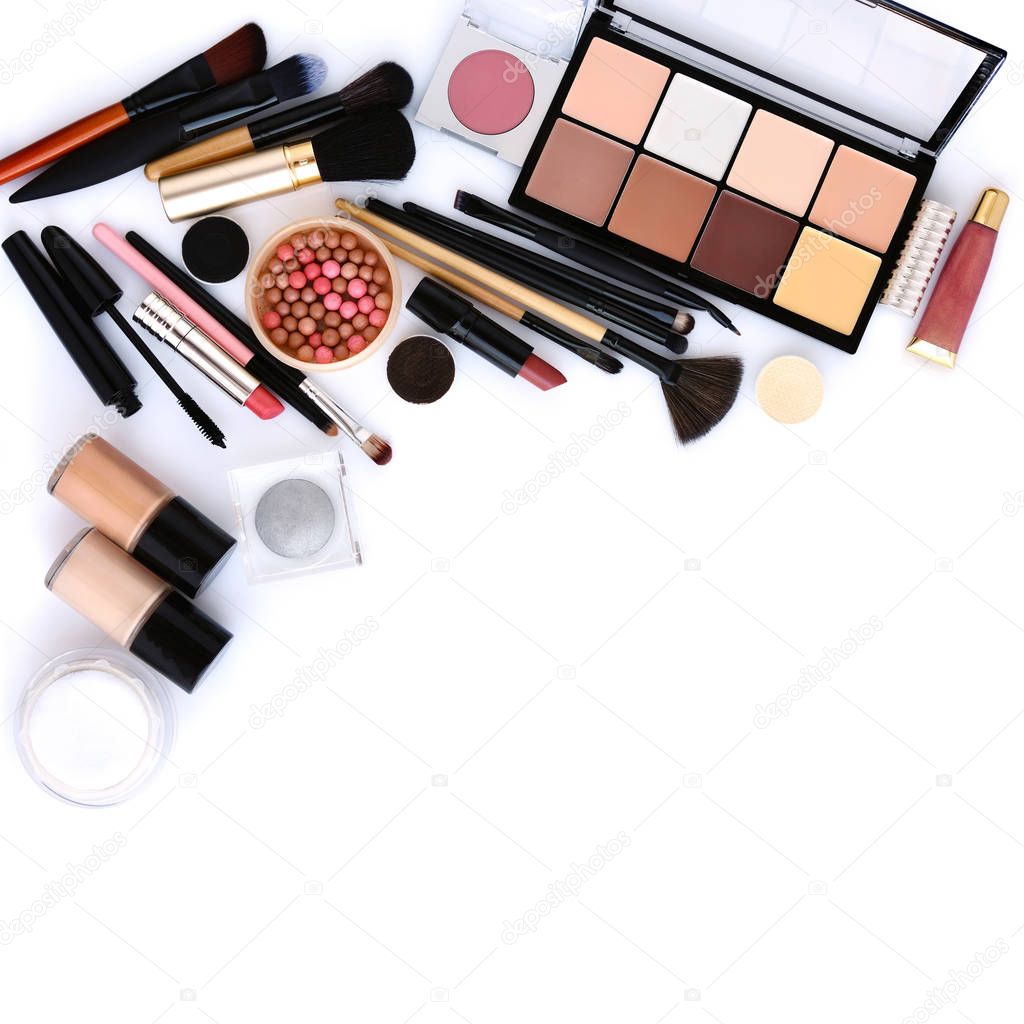 Makeup brush and decorative cosmetics on a white background with empty space