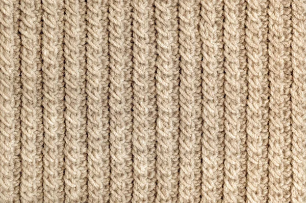 Knit texture of beige wool knitted fabric with cable pattern as background — Stock Photo, Image