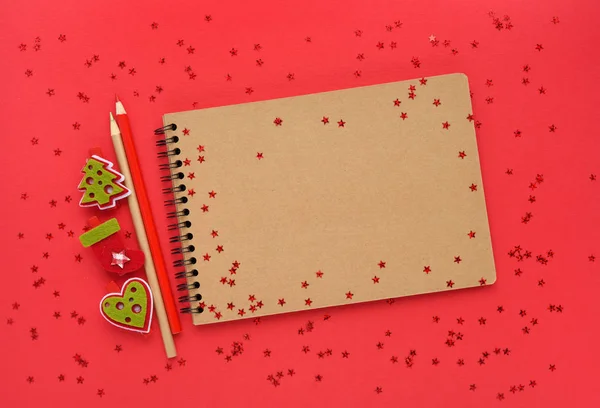 Christmas or New Year greeting card. The notebook with pencils and christmas — Stock Photo, Image