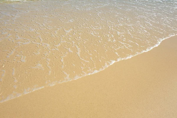Zand en golf achtergrond — Stockfoto