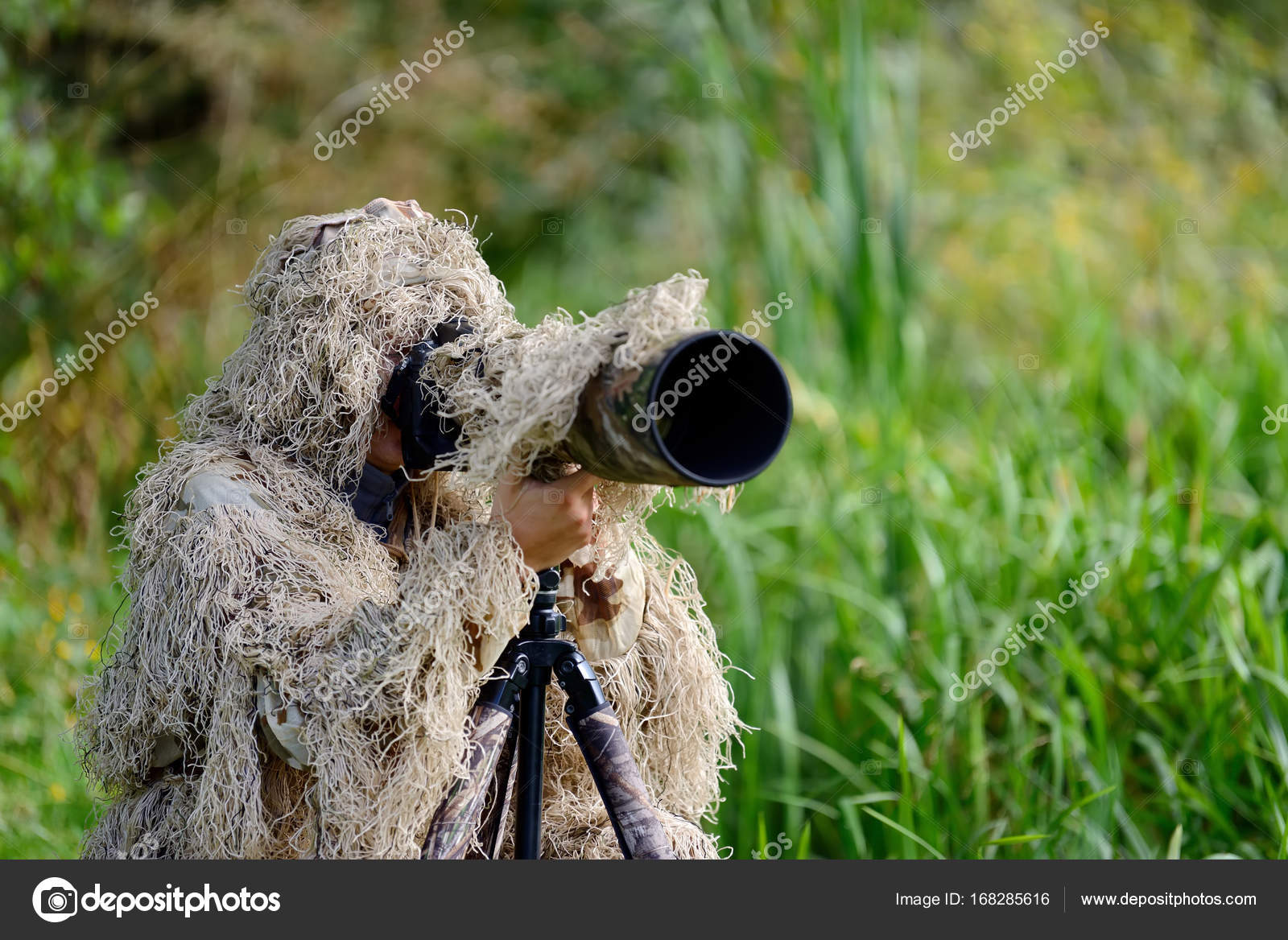 Sniper in camouflage suit looking at the target - Stock Image - Everypixel