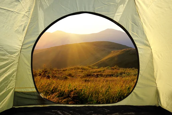 View from inside a tent on mountains landscape