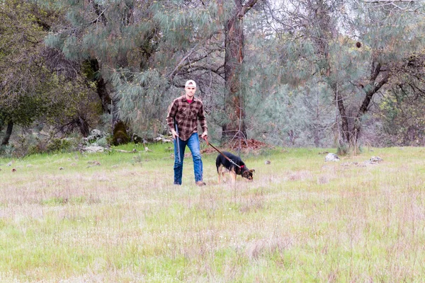 Man Hunting With Dog