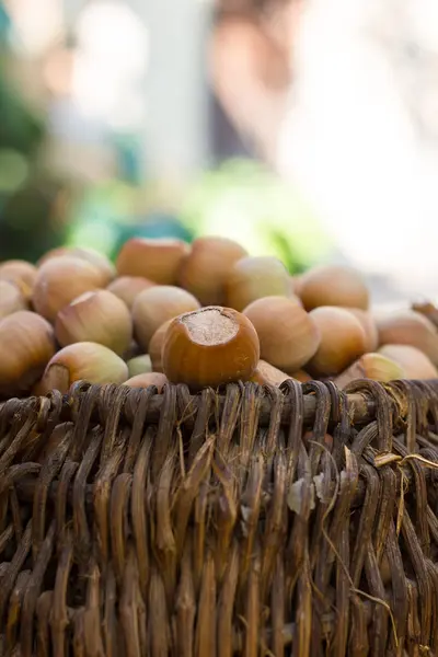 A basket of toasted hazelnuts inviting — Stock Photo, Image