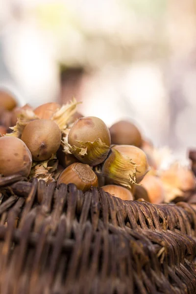 A basket of toasted hazelnuts inviting — Stock Photo, Image