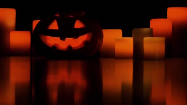 Helloween pumpkin and candles — Stock Video