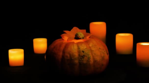 Helloween pumpkin rotation and candles dolly shot — Stock Video