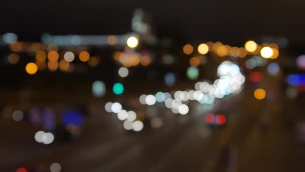 Blur background. Moving bokeh circles of night traffic. Defocused night traffic lights at Ratchaprasong Intersection Bangkok, Thailand. Moving particles. Colorful, blurred, bokeh lights background. — Stock Video