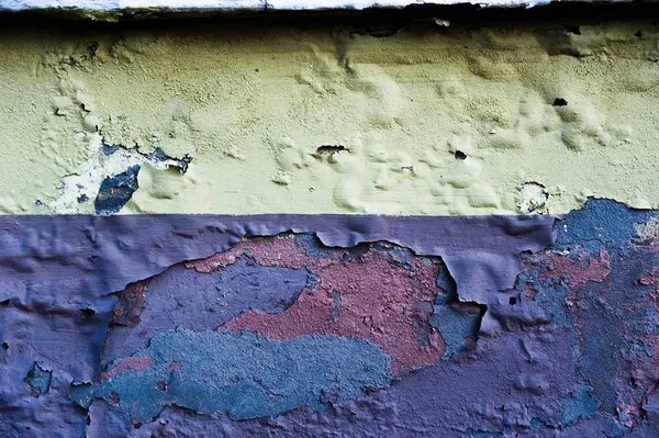 Rotten concrete wall with blown paint — Stock Photo, Image