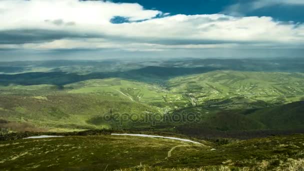 Summer landscape in mountains and dark blue sky. The clouds fly over the mountains and cast a shadow over the Karpaty mountains Time lapse. The concept of freedom, travel and a healthy lifestyle. High — Stock Video