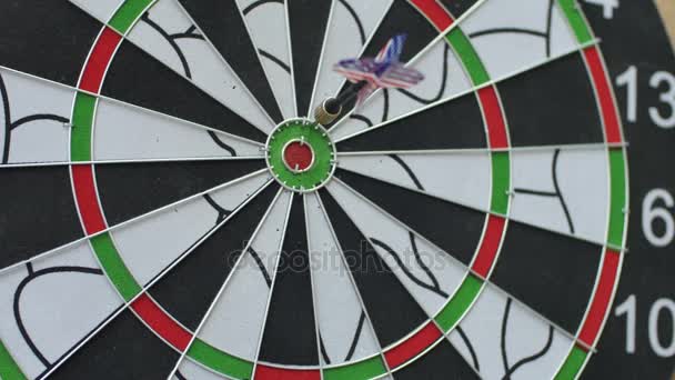 Dart hitting bulls eye, bulls-eye three shots . Concept of successful business ideas hitting the exact center of the target. Perfect performance of the task and superiority over the rivals. — Stock Video