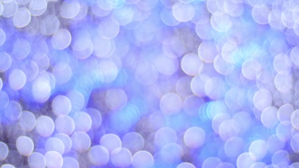 Holiday purple blue pink violet natural texture. Blurred bokeh colorful lights lanterns, holiday new year lighting on black background Christmas winter glitter shiny light bokeh in rainbow colors. — Stock Video