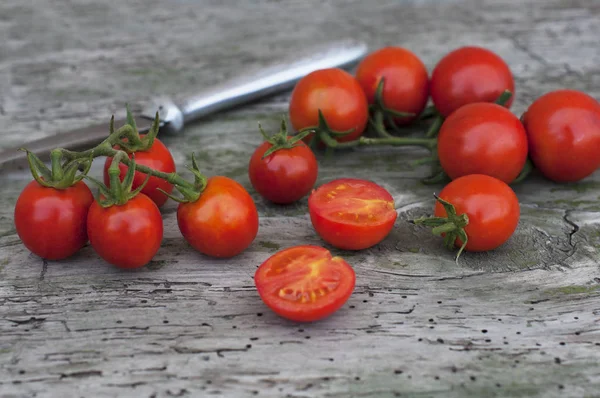 Fresh cherry tomatoes on wooden background — Stock Photo, Image