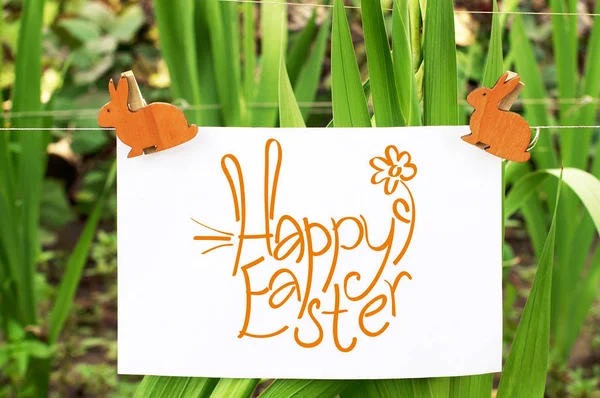 Leaf Inscription Happy Easter Attached Clothespegs Rabbits Background Green Grass — Stock Photo, Image