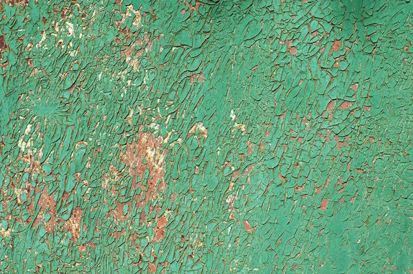 Texture with covered paint. Green background with rust