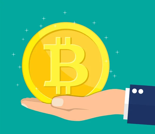 Arany érme bitcoin jel a kezében. — Stock Vector