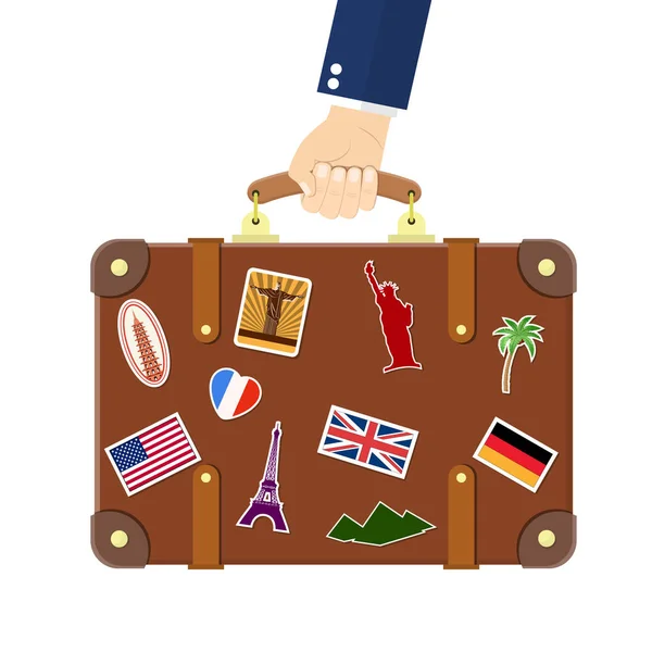Vintage old travel suitcase in hand. — Stock Vector