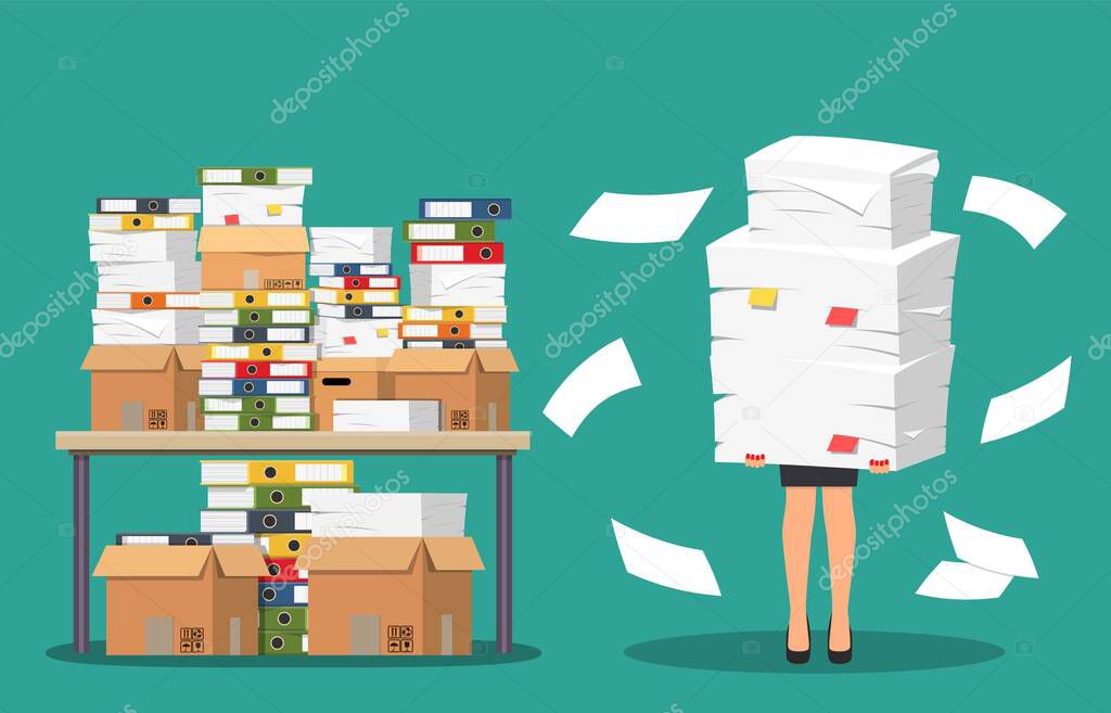 Businesswoman holds pile of office papers and documents.