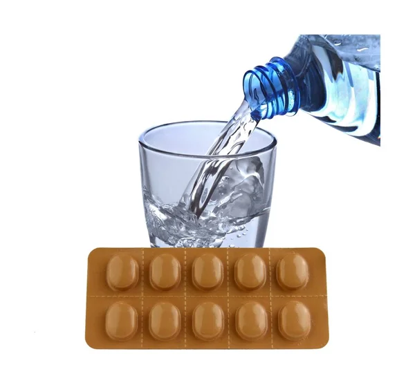 Tablets with water glass — Stock Photo, Image