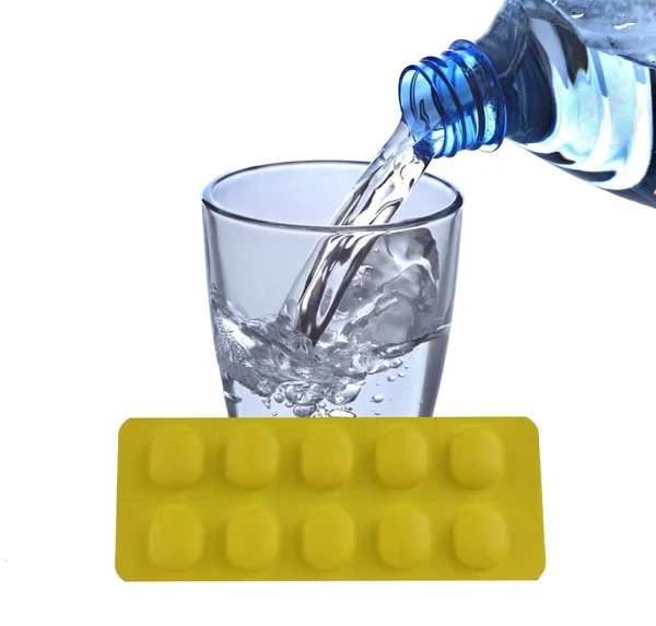 Tablets with water glass — Stock Photo, Image