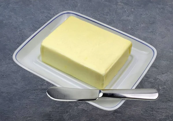 Butter with knife — Stock Photo, Image