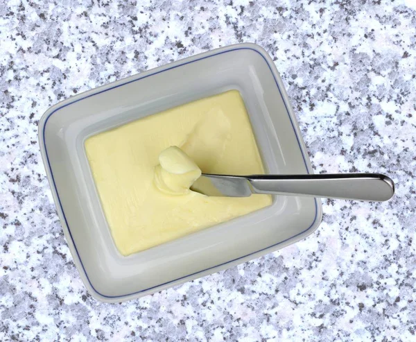 Butter with knife — Stock Photo, Image