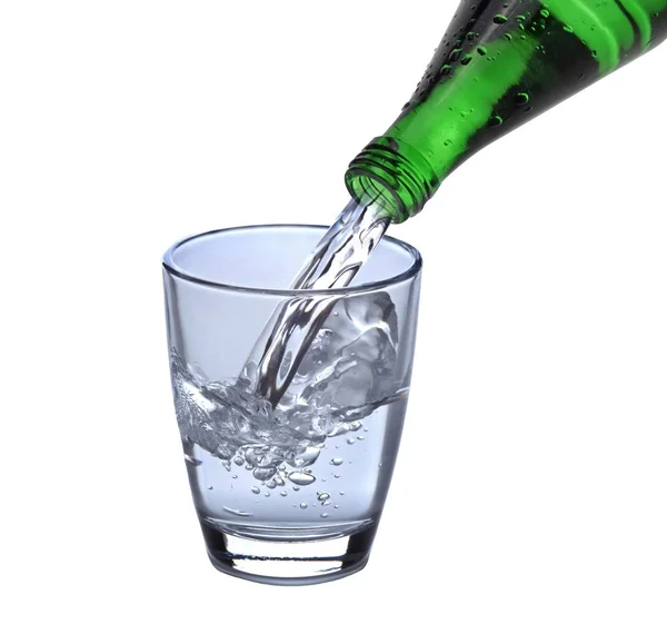 Bicchiere d'acqua con bottiglia Fotografia Stock
