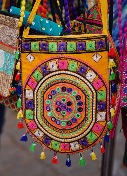 Closeup of Indian woman hand bags in display, in a street market