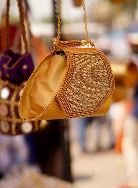 Closeup of Indian woman handmade purse or  hand bag in display of shop