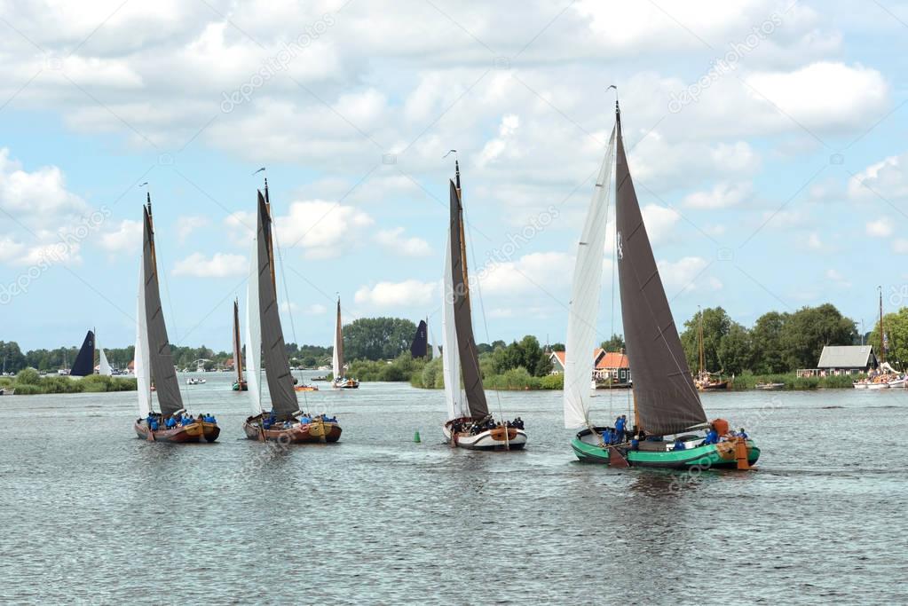 Traditional Frisian wooden sailing ships in a yearly competition