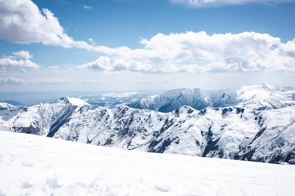 Mountain descent and mountains. Clouds in the sky