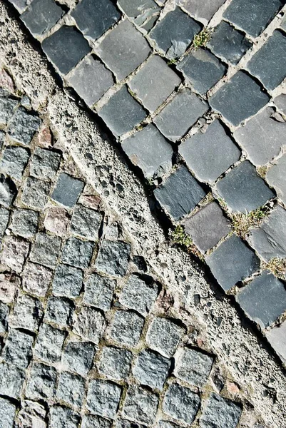 Kopfsteinpflaster Straße und Pflaster Textur. diagonale Trennung. — Stockfoto