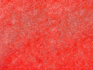 Kırmızı sıva dokusu. Kırmızı kabarık yüzey. Seçici odak