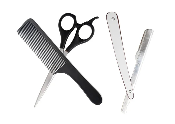 Comb with scissors and razor on a white background — Stock Photo, Image